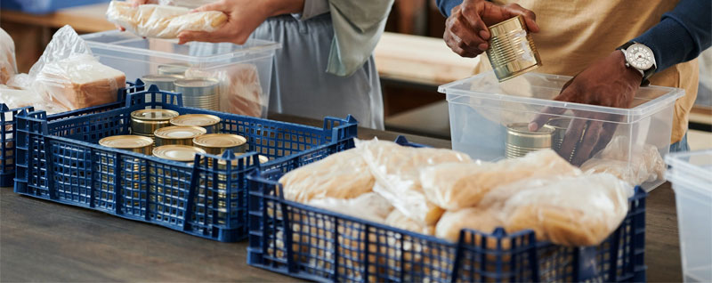 Volunteers helping pack nonperishable foods